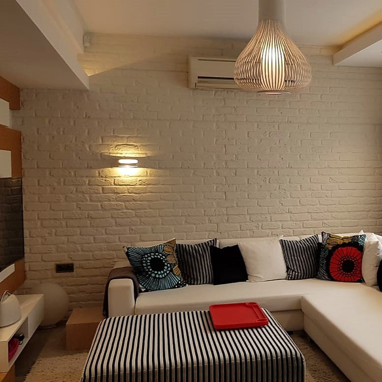 Diseño de interiores y acondicionamiento de apartamentos Astur en Antalya, Turquía: Espacios residenciales modernos